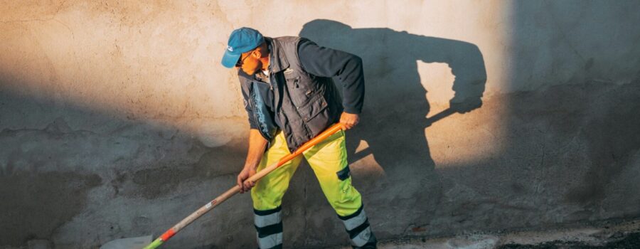 pavement sealcoating, pavement sealcoat, worker working on pavement, pot hole repair, who fixes pot holes, who fixes potholes,